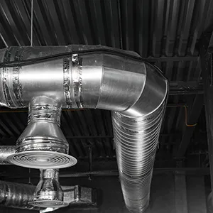 A black and white photo of a metal pipe.
